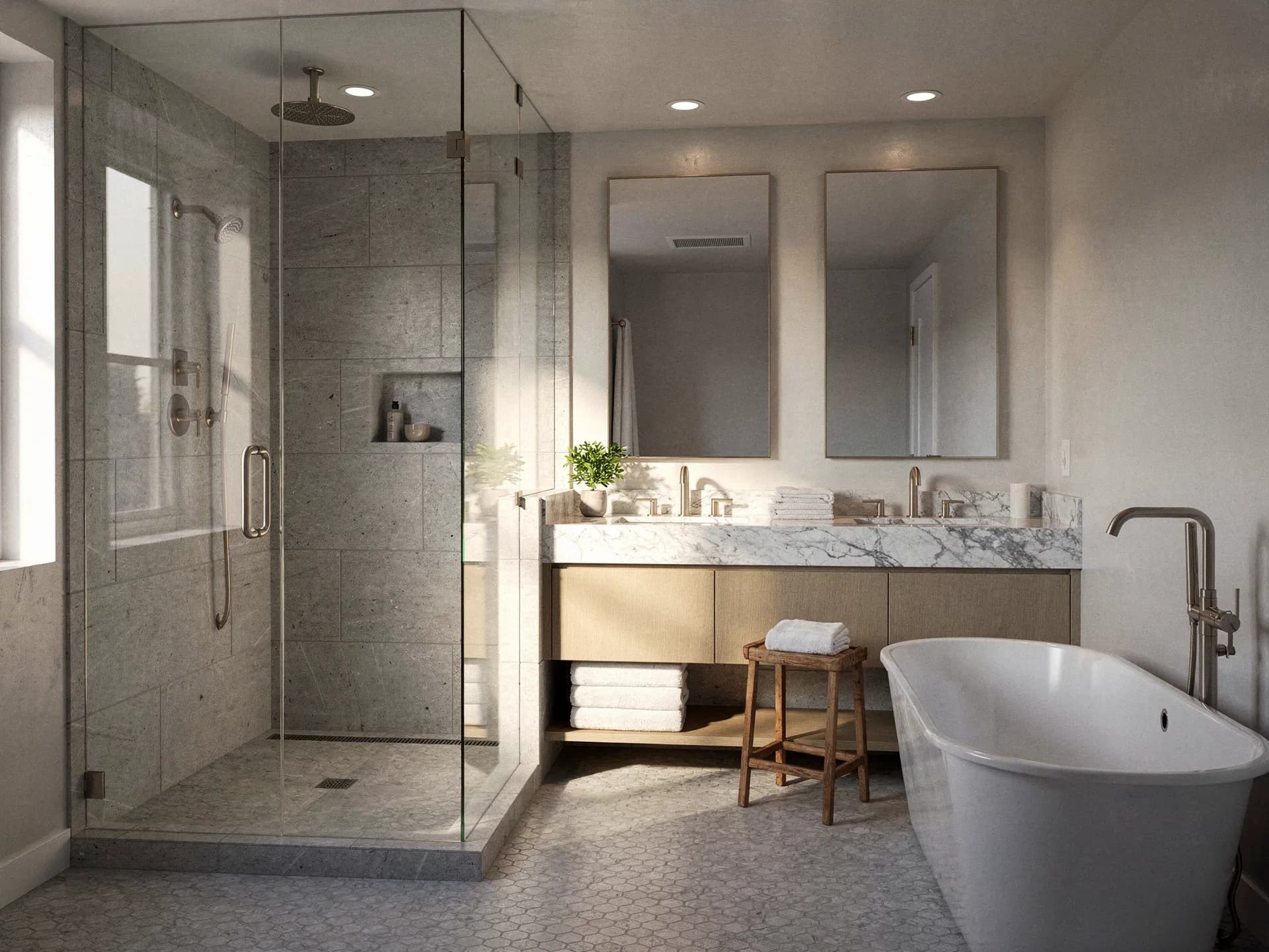 Large-format gray tile going up in a walk-in shower mid bathroom remodel, white spacers, a notched trowel and a level on the curb.